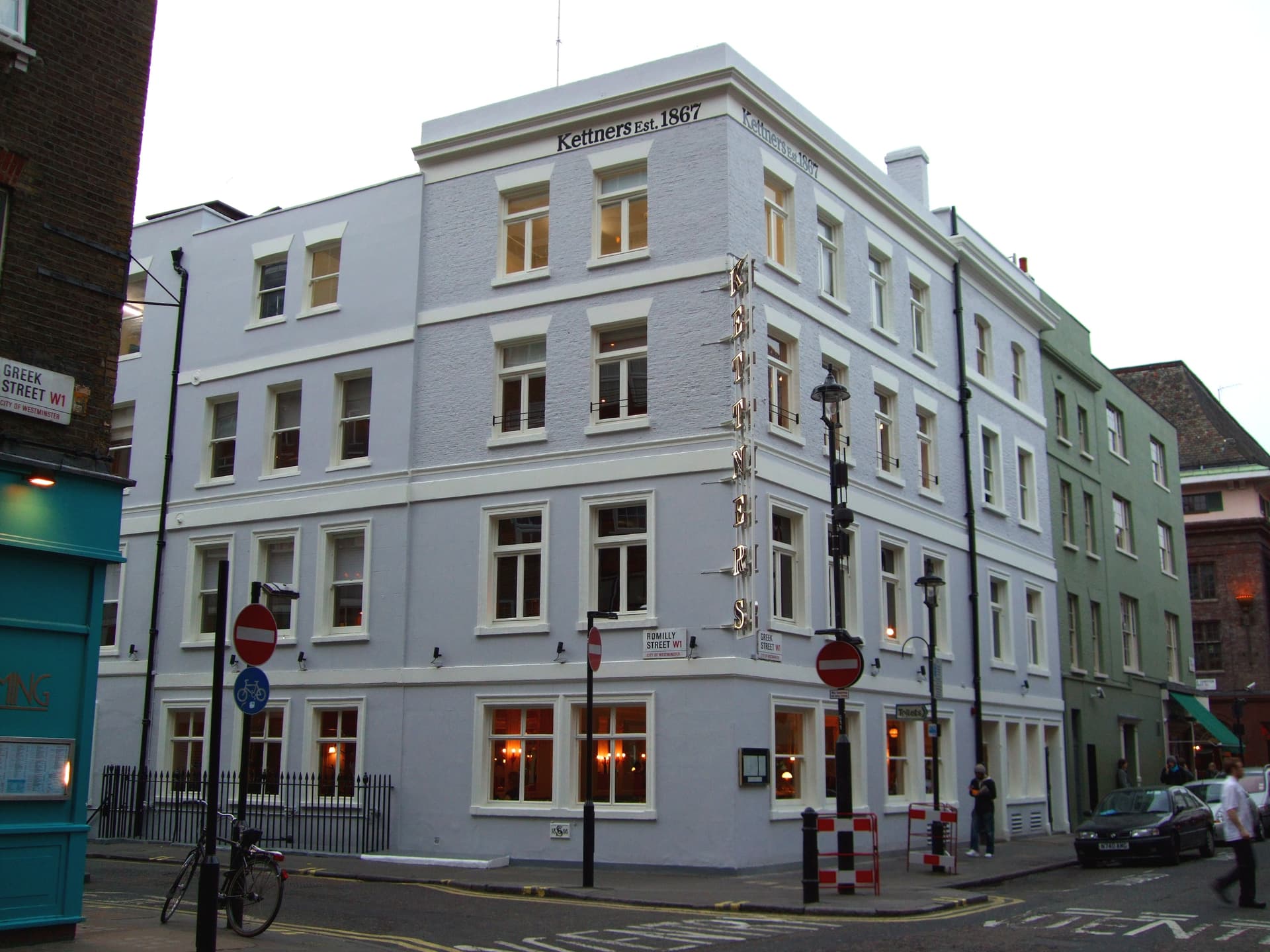 Pale blue painted corner building bearing Kettners Est. 1867 lettering at the junction of Romilly Street and Greek Street, Soho